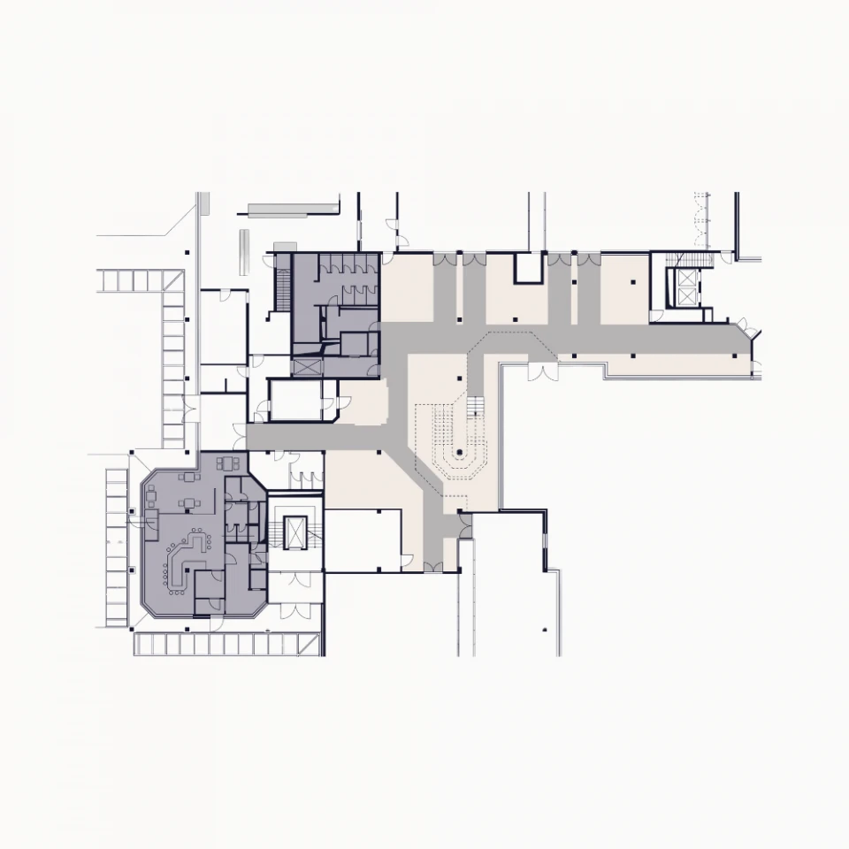 Floor plan of a modern event and conference center featuring well-organized spaces. Detailed layout of various sections including meeting rooms, lounge areas, and main corridors. The central staircase connects multiple levels, while adjacent conference rooms allow for flexible space utilization. Marked areas indicate different functional zones optimized for meetings, presentations, and networking.