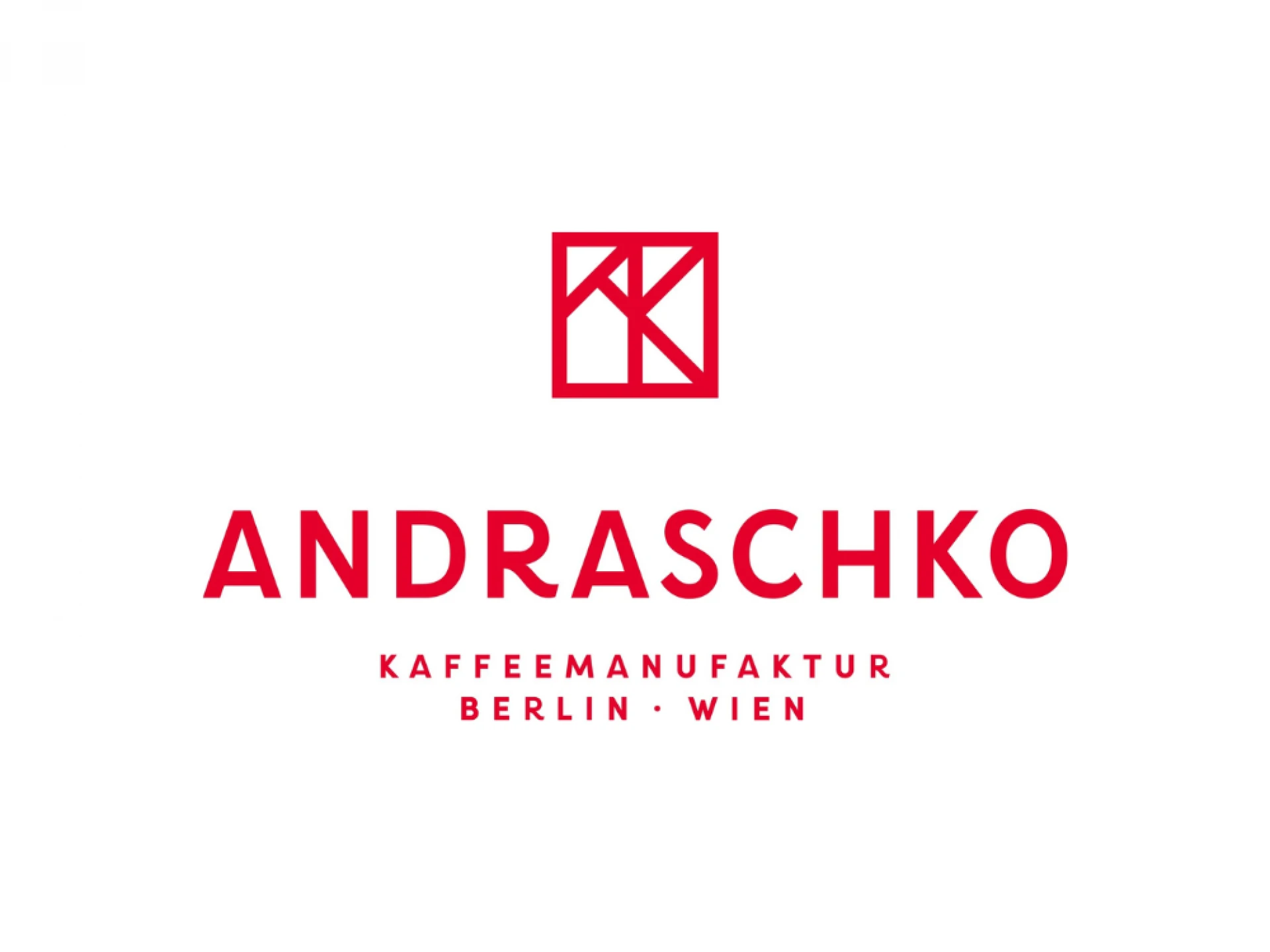 Logo der Andraschko Kaffeemanufaktur mit Standorten in Berlin und Wien. Rotes Logo-Symbol über dem Namen 'ANDRASCHKO' in Großbuchstaben und darunter 'Kaffeemanufaktur Berlin - Wien'.